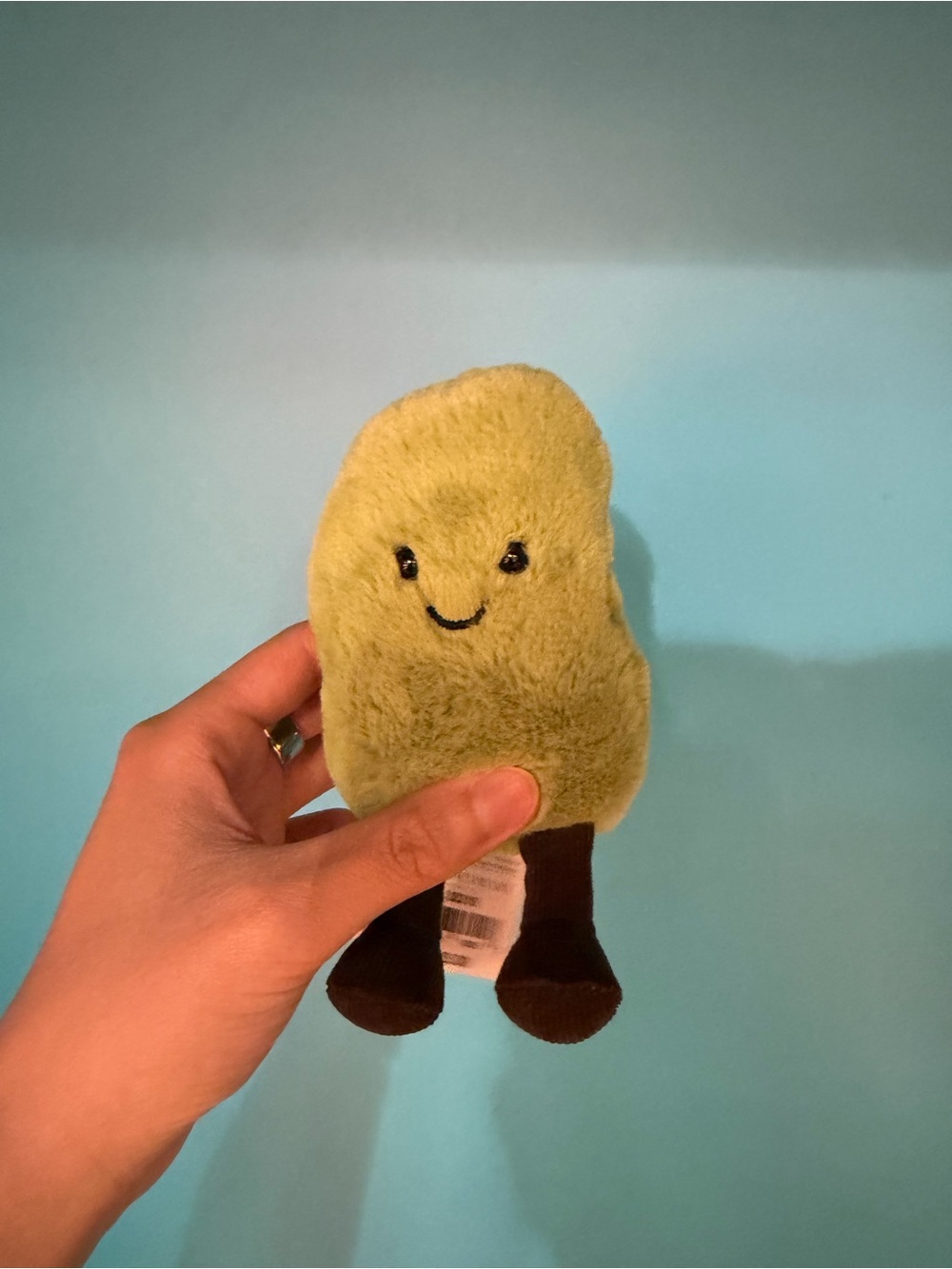 Green Plush Avocado Toy with Smiling Face edamame